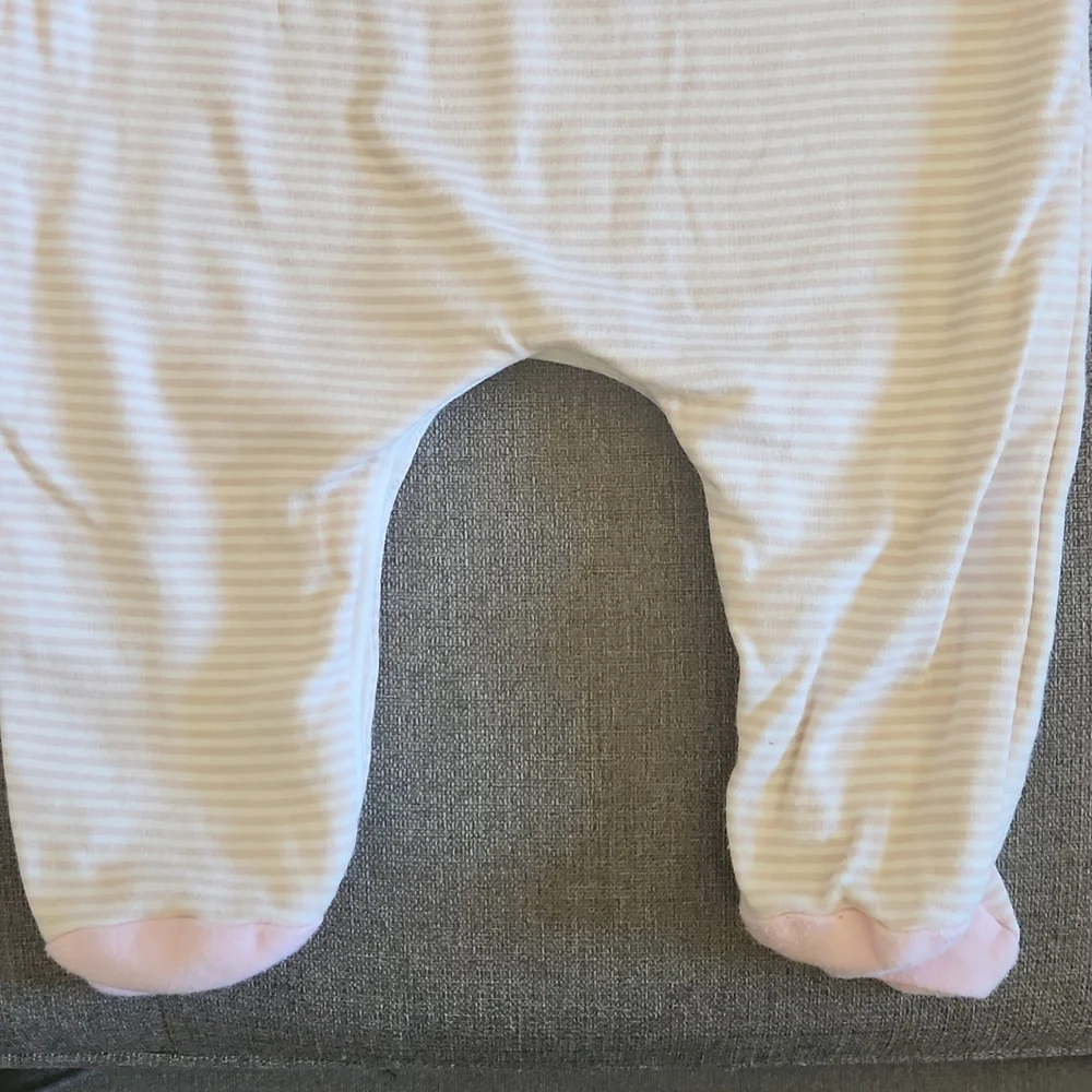 One Piece footed soft pink bodysuit